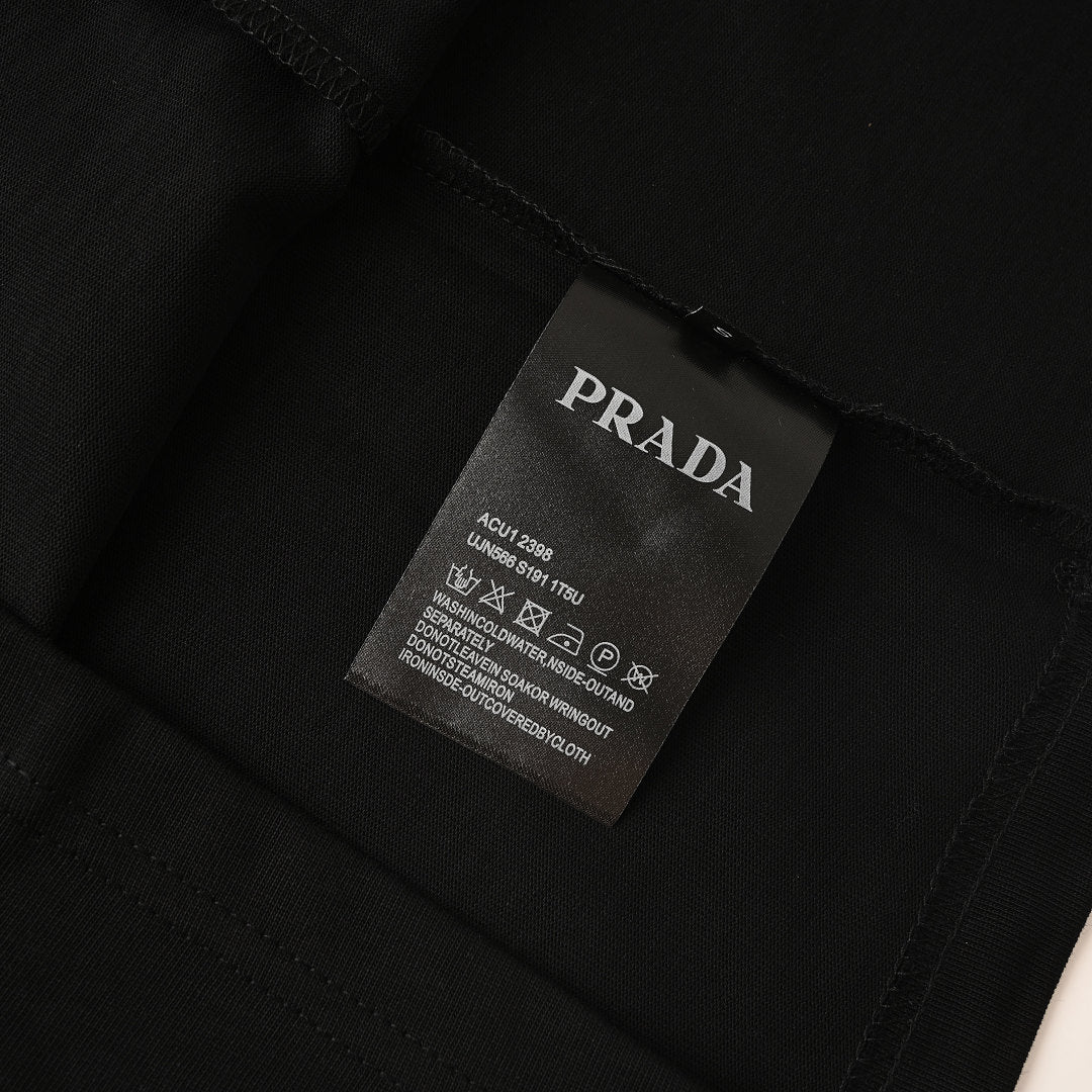 PRADA T-shirt with small figure graphic at the neckline