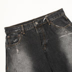 Acne Studios Distressed Denim Trousers with Paint Splatter Effect