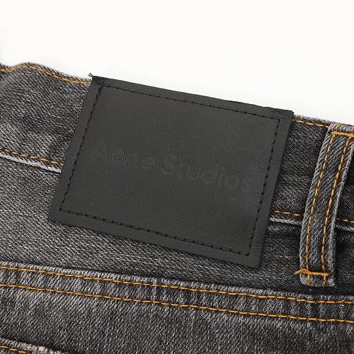 Acne Studios Distressed Denim Trousers with Paint Splatter Effect
