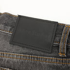 Acne Studios Distressed Denim Trousers with Paint Splatter Effect