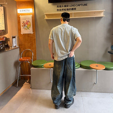 Balenciaga Distressed Loose-Fit Jeans with Leg Patch Detail