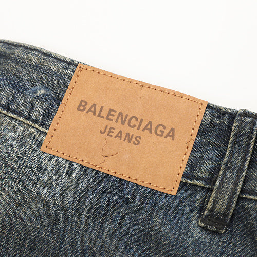 Balenciaga Distressed Loose-Fit Jeans with Leg Patch Detail